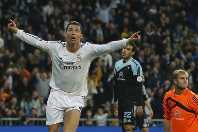 Real Madrid's Cristiano Ronaldo from Portugal (left) celebrates his goal during a Spanish La Liga soccer match between Real Madrid and Celta at the Santiago Bernabeu Stadium in Madrid, Spain on Monday.