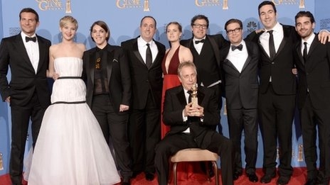 The cast and producers of American Hustle pose with their best film comedy or musical award