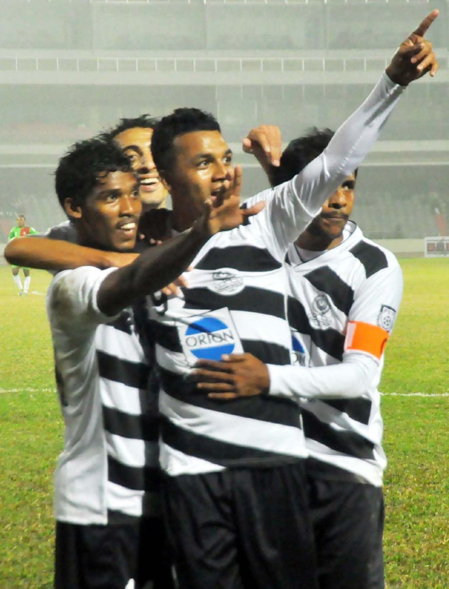 Players of Dhaka Mohammedan Sporting Club Limited celebrate after scoring a goal against Team BJMC during the football match of the Bangladesh Premier League at the Bangabandhu National Stadium on Wednesday. Agency photo