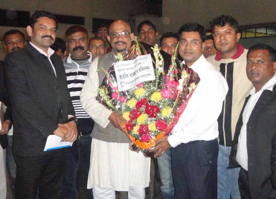 Officials of Bangladesh Football Federation(BFF) giving reception to the Deputy Minister for Youth and Sports Arif Khan Joy with a bouquet at the BFF House on Wednesday.