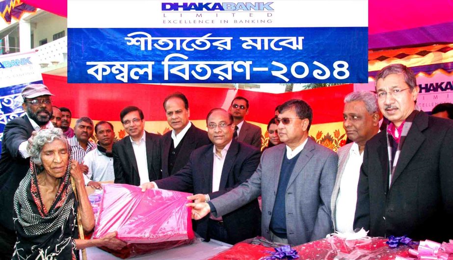 ATM Hayatuzzaman Khan, former Chairman and sponsor share holder of Dhaka Bank Ltd distributing blankets among the cold-hit distressed people of Araihazar, Narayanganj on Tuesday as part of Corporate Social Responsibility (CSR).