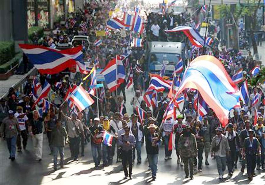 Anti-government protesters march during a rally in central Bangkok on Thursday.