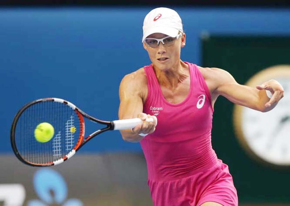 Samantha Stosur of Australia makes a forehand return to Ana Ivanovic of Serbia during their third round match at the Australian Open tennis championship in Melbourne, Australia on Friday.