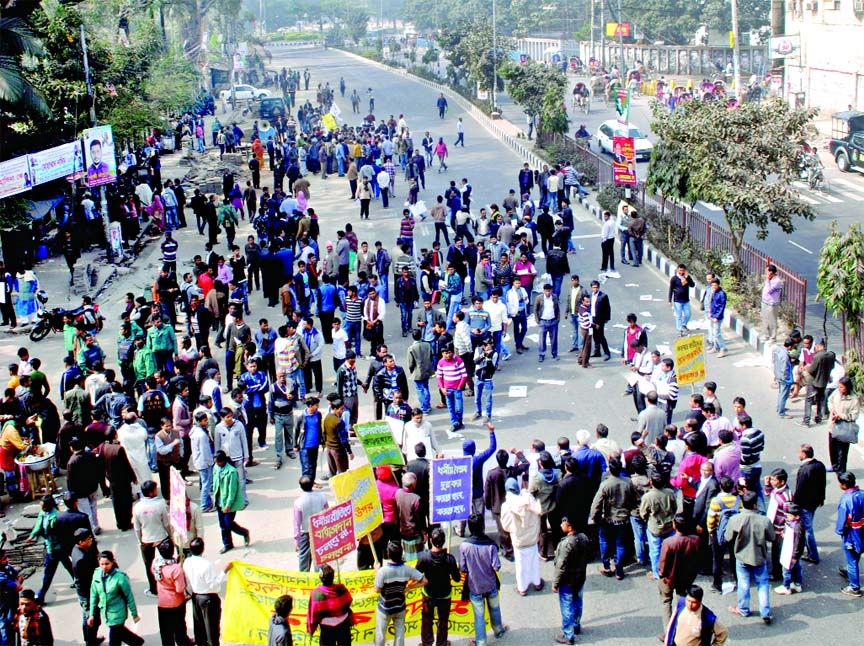 Members of the minority community staged a rally on Friday in front of the Jatiya Press Club protesting attack on them after Jan 5 election.