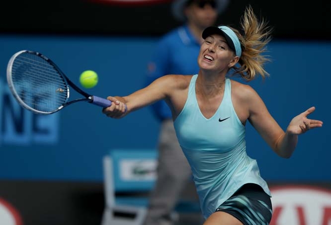 Maria Sharapova of Russia hits a forehand return to Alize Cornet of France during their third round match at the Australian Open tennis championship in Melbourne, Australia on Saturday.