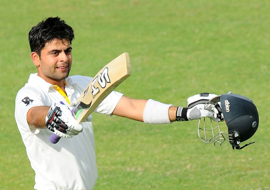 Ahmed Shehzad raises his bat after scoring his maiden hundred on 3rd day of 3rd Test between Pakistan and Sri Lanka at Sharjah on Saturday. Agency photo