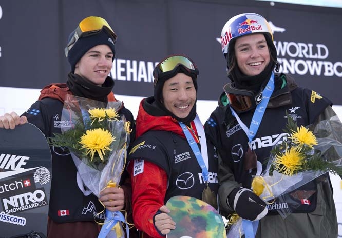 Gold medallist Ryo Aono of Japan, flanked on the podium by silver medallist Jan Scherrer (left) of Switzerland and bronze medallist Scotty James of Australia, after the men's snowboard half pipe world cup final in Stoneham, Quebec on Saturday.