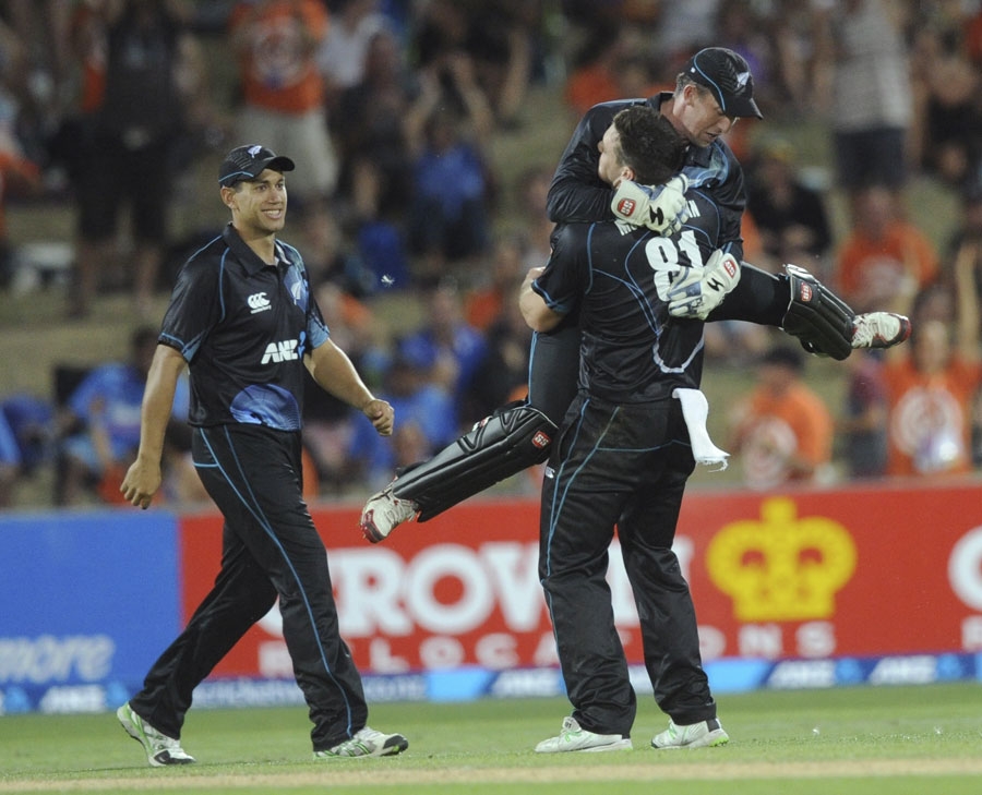 Mitchell McClenaghan is congratulated after a wicket during 1st ODI between New Zealand and India at Napier on Sunday.