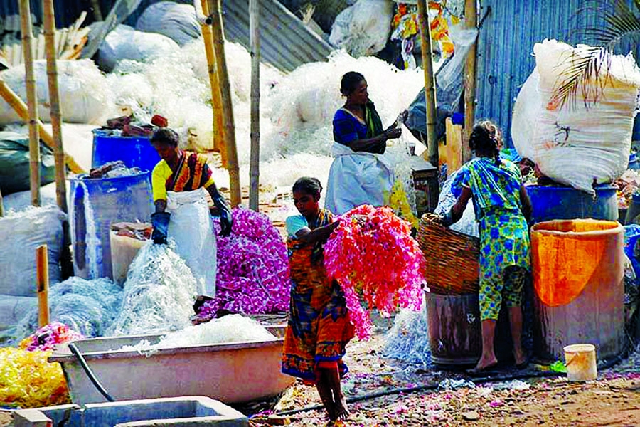 Plastic waste being collected from different sources for recycling those in factories. Photo shows women workers processing the plastic waste at a factory premises in city's Keraniganj areas on Sunday.