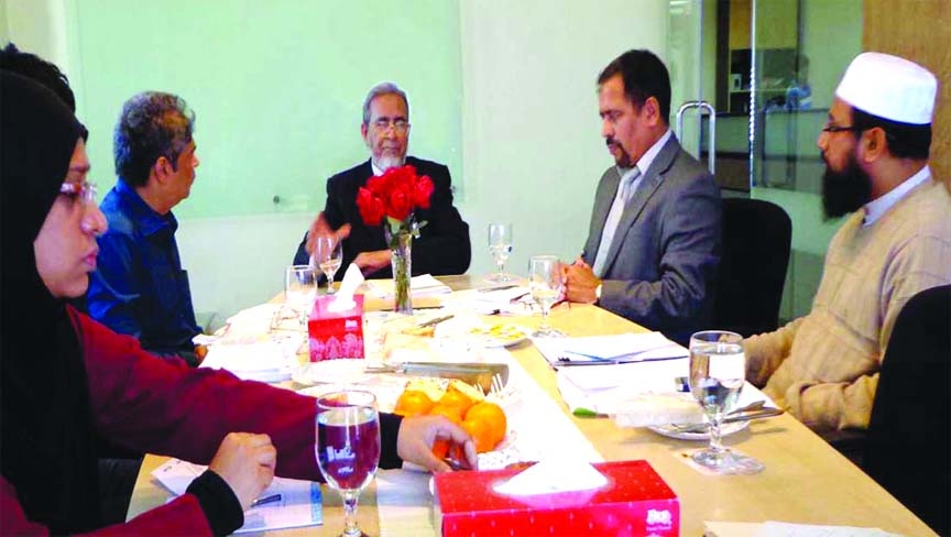 : Noted Islamic banking scholar M Azizul Huq presiding the Shariah Committee meeting of Alliance Capital Asset Management Limited (ACAML) at the Board Room of ACAML on Sunday.