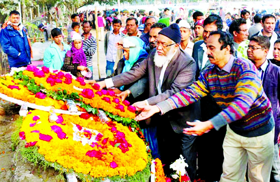 Different organisations placing floral wreaths at the memorial of Shaheed Asad in front of Dhaka Medical College and Hospital on Monday marking Shaheed Asad Day.
