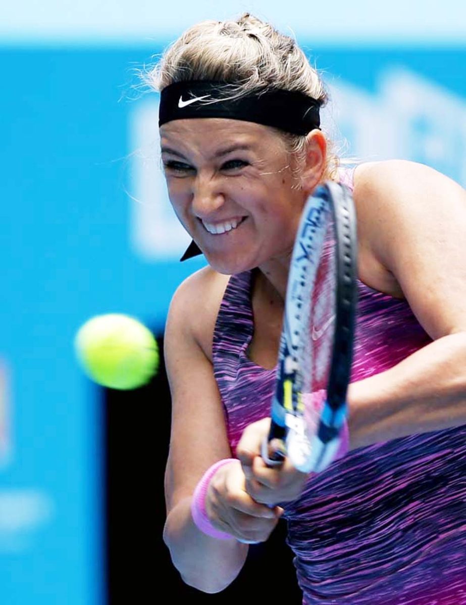 Victoria Azarenka of Belarus hits a backhand return to Sloane Stephens of the U.S. during their fourth round match at the Australian Open tennis championship in Melbourne, Australia on Monday.