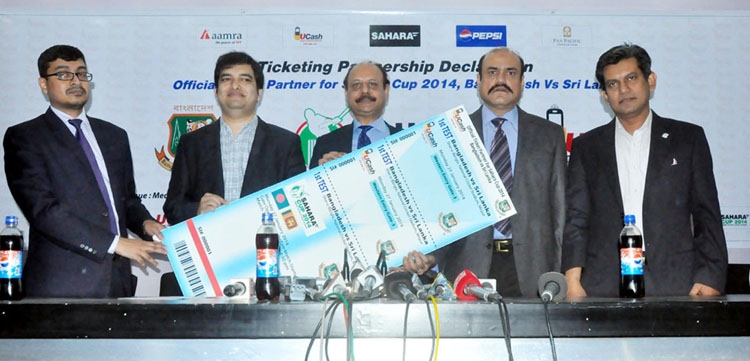 Managing Director of United Commercial Bank Lutfor Rahman (centre) formally opens the sale of tickets of the forthcoming series between Bangladesh and Sri Lanka at the conference room of the Sher-e-Bangla National Cricket Stadium in Mirpur on Tuesday.