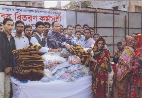 Warm cloths were distributed at Feringebazar on Tuesday organised by Nobin Ekota Sangho on Tuesday.