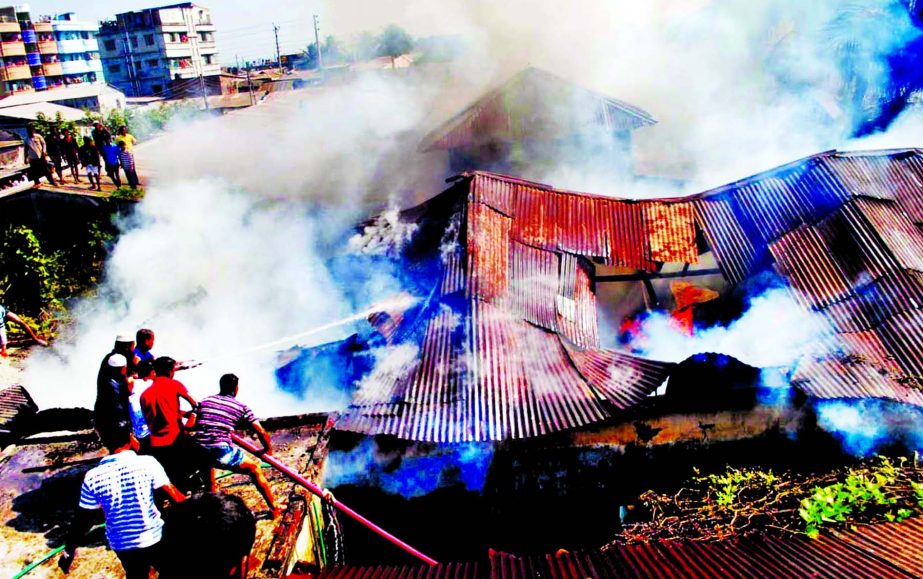 One cotton and a silver factories at Hatkhola area in Barisal city were gutted by devastated fire originated from electric short circuit on Tuesday.