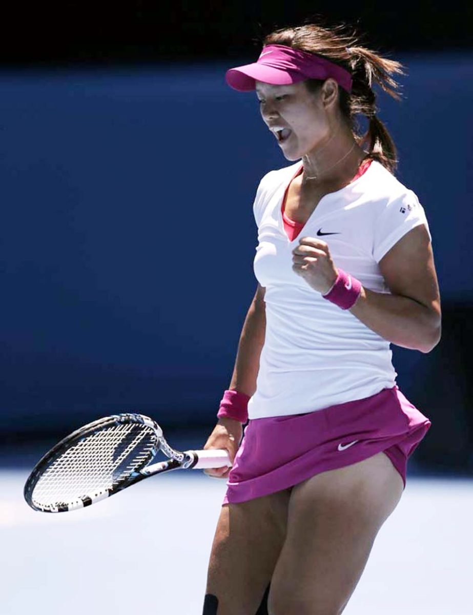 Li Na of China celebrates a point won against Eugenie Bouchard of Canada during their semifinal at the Australian Open tennis championship in Melbourne, Australia on Thursday.