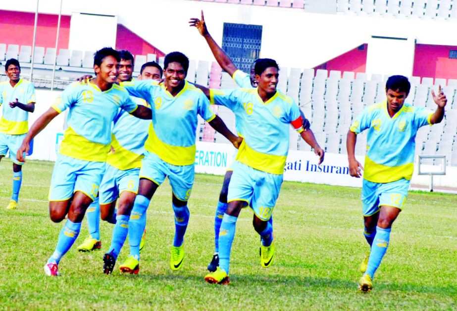 Players of Chittagong Abahani celebrate after beating Soccer Club Feni in the Bangladesh Premier Football League held at the Bangabandhu National Stadium on Friday .