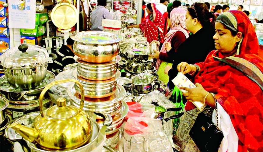 Buyers crowding at foreign pavilion of Dhaka Int'l Trade Fair to buy different brands of utensils. The photo was taken on Saturday.