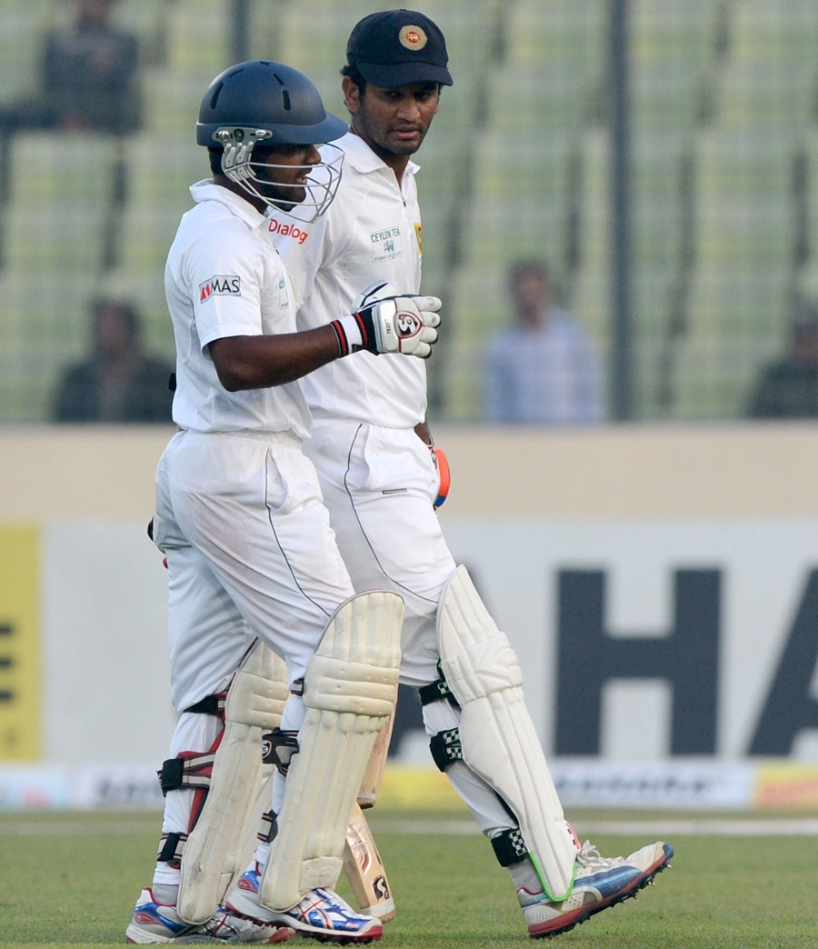 Kaushal Silva and Dimuth Karunaratne head back after a job well done on the first day of 1st Test between Bangladesh and Sri Lanka at the Sher-e-Bangla National Cricket Stadium in Mirpur on Monday.