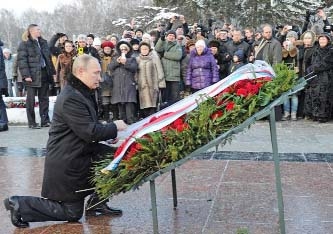 Russia's President Vladimir Putin takes part in a wreath laying ceremony at the Piskarevskoye cemetery-the memorial to the victims of the siege and blockade of Leningrad, now St. Petersburg.