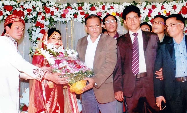 Former Minister Dr Hasan Mahmud, MP greeting a newly married couple in Chittagong.