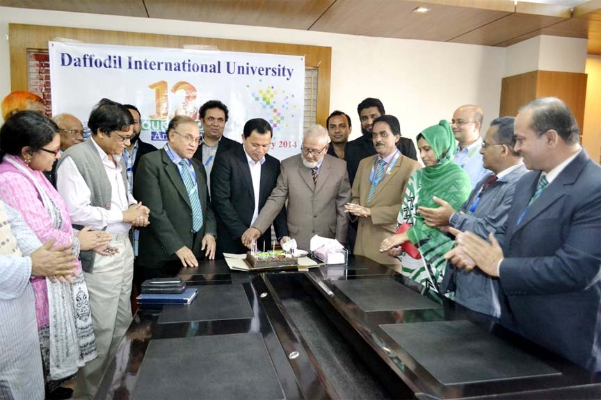 Md. Sabur Khan, Chairman, Board of Trustees, and Prof Dr Aminul Islam, Founder Vice Chancellor of Daffodil International University cutting a cake to mark the 12th Founding Day of the university on Friday. Prof Dr M Lutfar Rahman, Vice Chancellor and othe