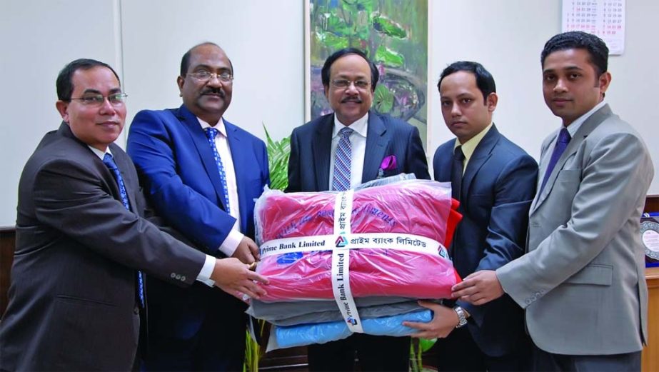 Managing Director & CEO of Prime Bank Md Ehsan Khasru handing over blankets to Deputy Governor of Bangladesh Bank Shitangshu Kumar Sur Chowdhury for distributing among the cold-stricken people at BB's Office on Tuesday.