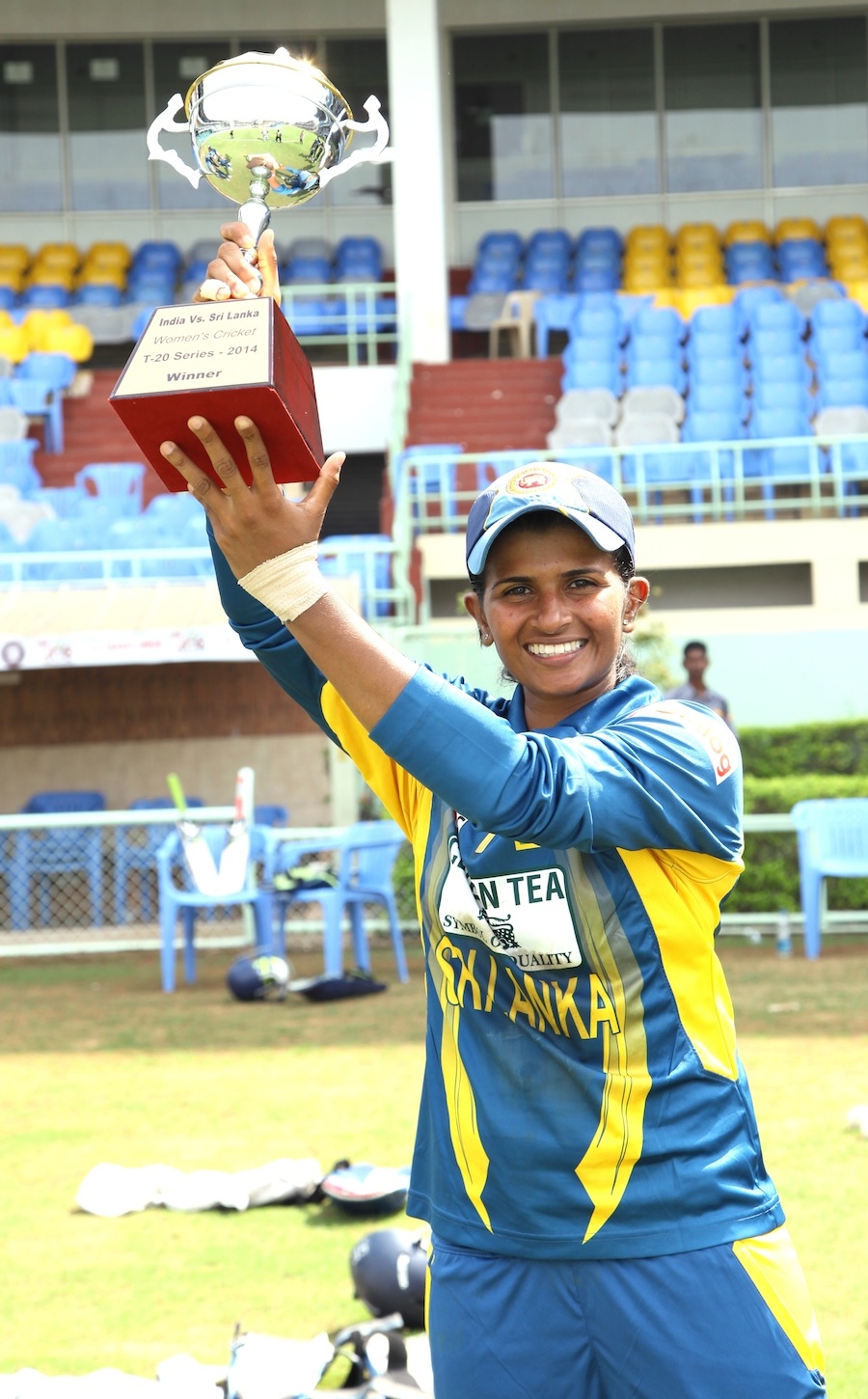 Shashikala Siriwardene poses with the series trophy after 3rd women's T20 between India and Sri Lanka in Visakhapatnam on Tuesday.
