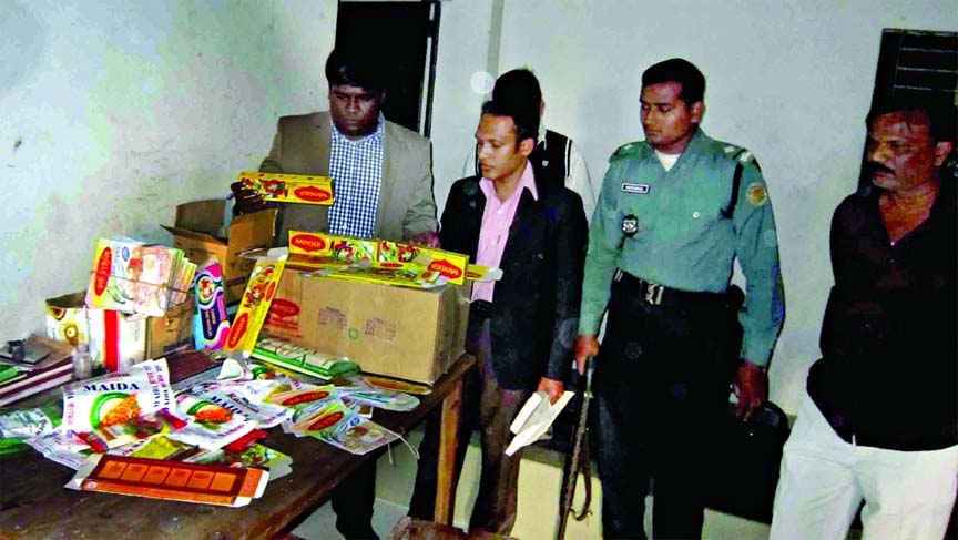 BSTI mobile court conducted a drive at the three business firms of Kamrangirchar area on Wednesday and fined Tk 2.20 lakh for producing and marketing of fake goods using labels of famous brands. This photo was taken on Wednesday.