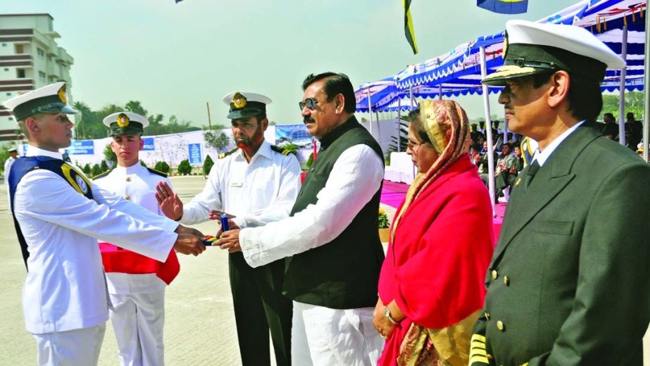 Shipping Minister Shajahan Khan, handing over certificates among the passing out cadets of International Maritime Academy in the academy premises at Gazipur on Thursday. State Minister for Women and Children Affairs Begum Meher Afroze Chumki, Secretary of