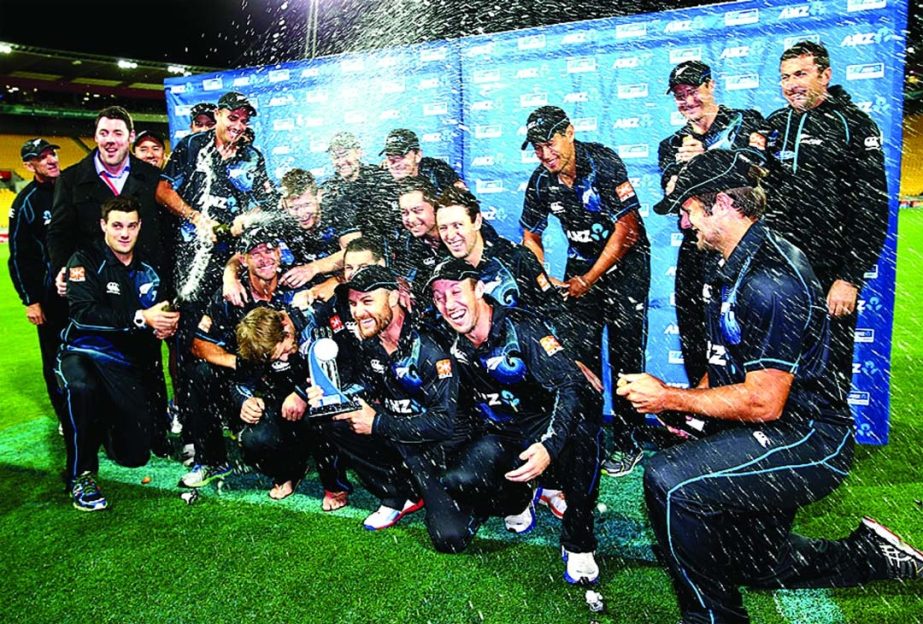 New Zealand players uncork the champagne and celebrate their 4-0 win over India after 5th ODI at Wellington on Friday.