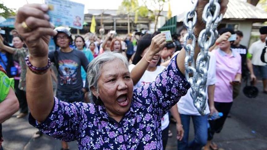 A woman demands to cast her vote in Bangkok.