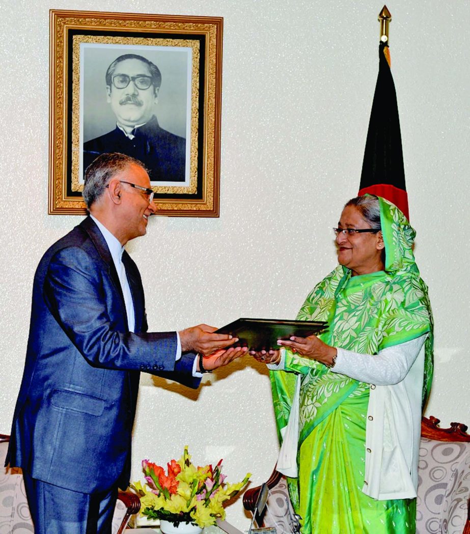 Iranian Envoy to Bangladesh Hossein Aminian Tousi handing over a letter of greetings of Iranian President Hasan Rouhani to Sheikh Hasina at her office on Sunday on her reelection as the Prime Minister of Bangladesh. BSS photo