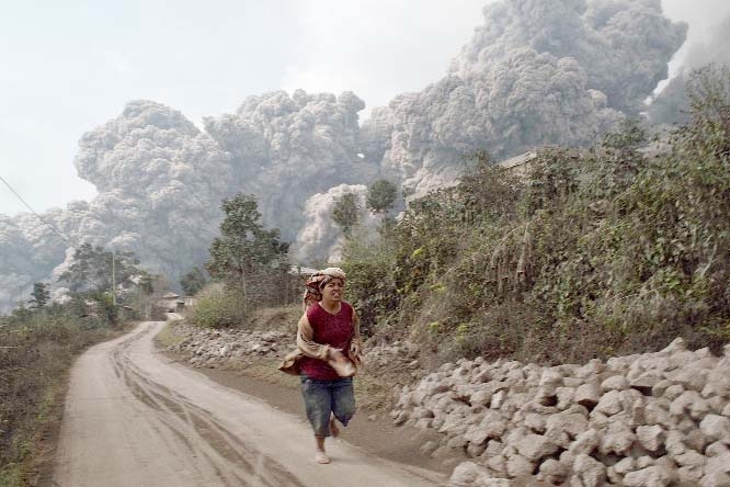 A villager ran as Mount Sinabung erupted in the North Sumatra Province of Indonesia.