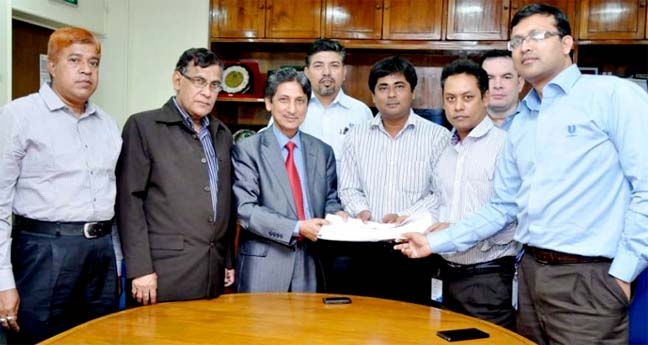 CDA Chairman Abdus Salam and Human Resources Manager (Factory) Kazi Saiful Islam exchanging the deal signing documents in the Conference Hall of Uniliver Bangladesh yesterday.