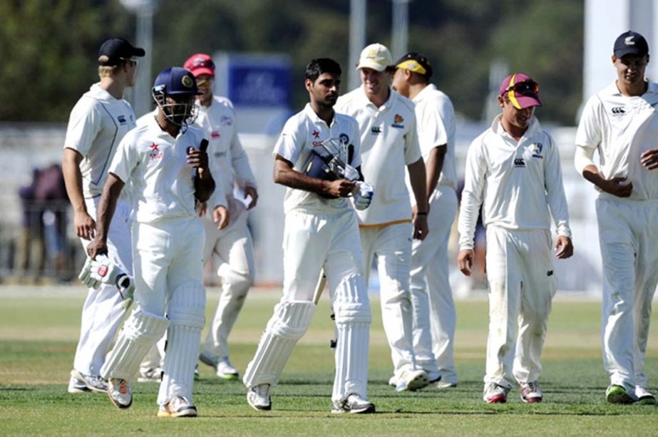 India's Ambati Rayudu, (left) and Bhuvneshwar Kumar leave the pitch after drawing with New Zealand XI on the second day of a pre Test warm up cricket match at Cobham Oval in Whangarei, New Zealand on Monday.
