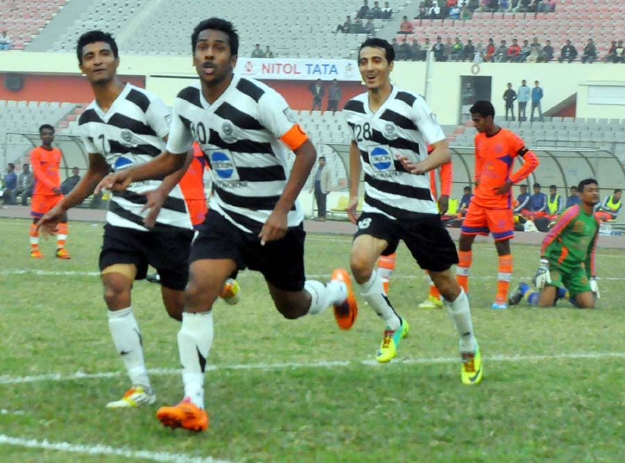 Players of Dhaka Mohammedan Sporting Club celebrate after scoring against Brothers Union in their match of the Nitol Tata Bangladesh Premier Football League at the Bangabandhu National Stadium on Tuesday. The match ended in a 1-1 draw.