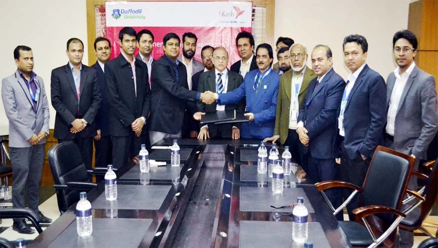 Prof Dr Engr AKM Fazlul Hoque, Registrar, Daffodil International University and Rezaul Hossain, Chief Commercial Manager, bKash Ltd exchanging the MoU while Prof Dr M Lutfar Rahman and other high officials were present on the occasion.