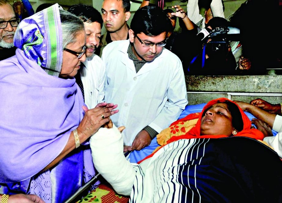 Prime Minister Sheikh Hasina visits people who were wounded by Jamaat-Shibir cadre in the post-polls violence at Pangu Hospital in the city on Wednesday.