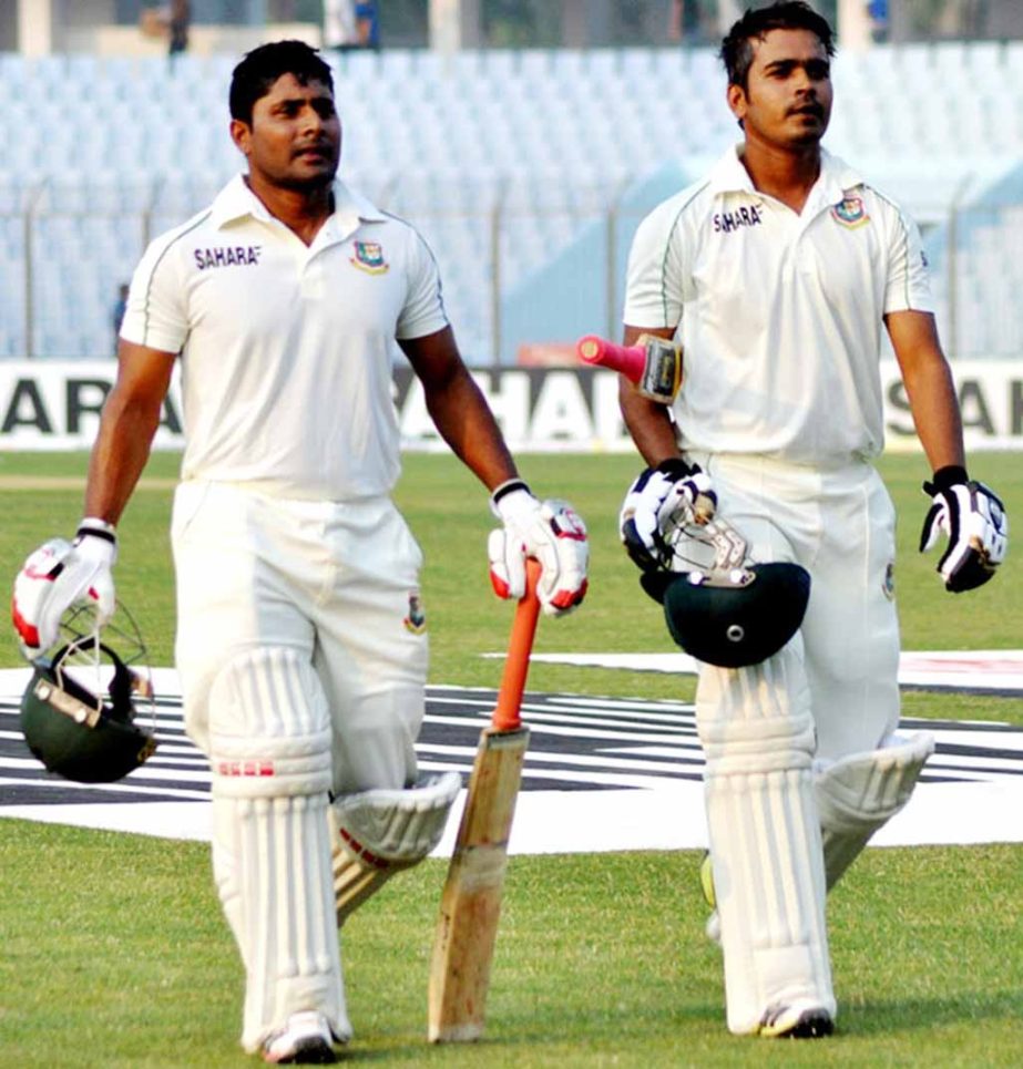 Imrul Kayes (left) and Shamsur Rahman coming out from the field after their unfinished first innings batting of the second day play of the 2nd Test against Sri Lanka at the Zahur Ahmed Chowdhury Stadium in Chittagong on Wednesday.