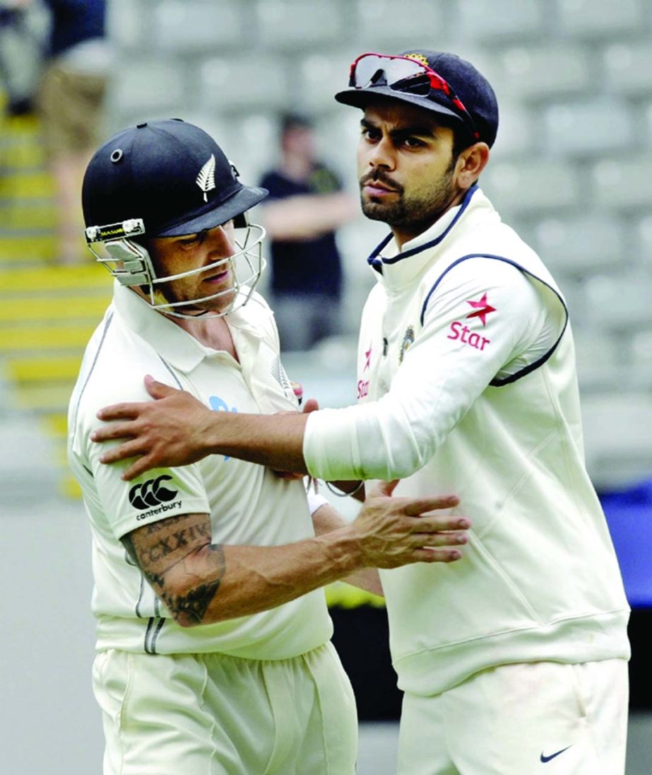 New Zealandâ€™s Brendon McCullum (left) is congratulated by India's Virat Kohli after reaching double century on the second day of the first cricket test at Eden Park in Auckland, New Zealand on Friday.