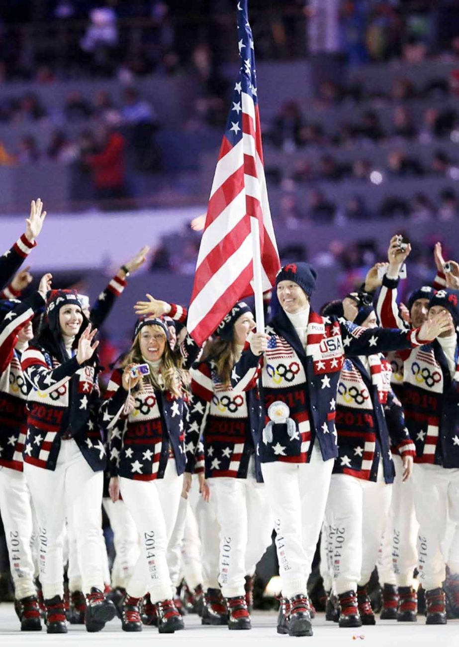 Todd Lodwick of the United States carries the national flag as he leads his team into the stadium during the opening ceremony of the 2014 Winter Olympics in Sochi, Russia on Friday.