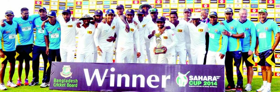 Members of Sri Lankan team celebrate with the trophy after winning Test series against Bangladesh at the Zahur Ahmed Chowdhury Stadium in Chittagong on Saturday.