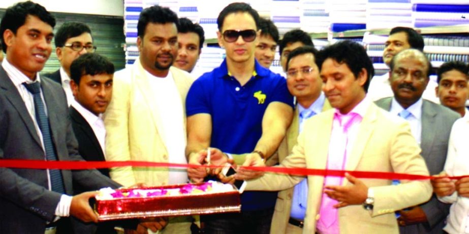 Model Nobel inaugurating the new outlet of Top Ten Fabrics and Tailors Ltd at Mirpur-11 in the city on Friday. Sayed Hossain, Managing Director and Md Uzzal Hossain, Director of the company were present on the occasion.