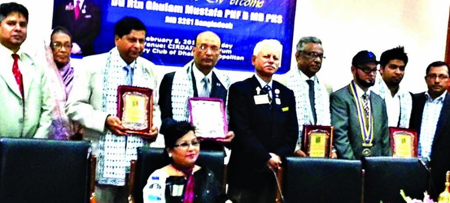 Governor of Rotary International Bangladesh Golam Mostofa along with other distinguished guests pose for photograph at a reception accorded to elite recently at CIRDAP auditorium in the city by Rotary Club of Dhaka Cosmopolitan.