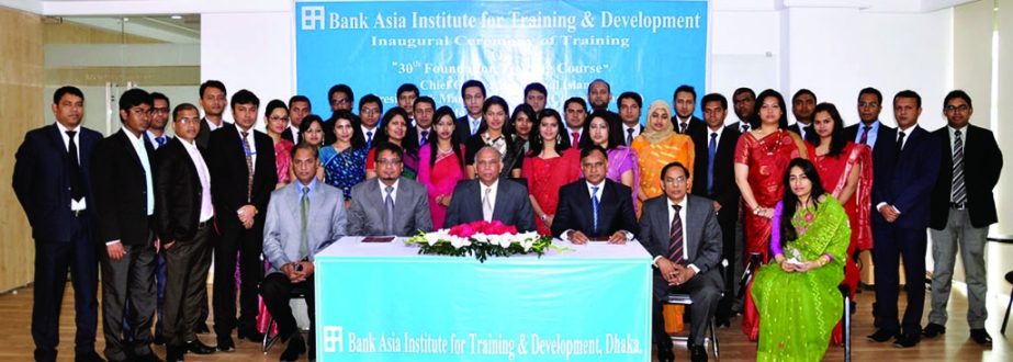 Aminul Islam, President & Managing Director (current charge) of Bank Asia, poses with the participants of the 30th Foundation Training Program in the inaugural ceremony held at the Bank's Training & Development Center in Dhaka on Sunday.