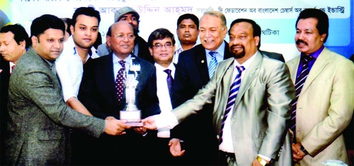 Commerce Minister Tofail Ahmed handing over Best Pavilion crest to Md Harun Ur Rashid, CIP, Chairman of Asian Textile on the concluding day of Dhaka International Trade Fair on Monday.