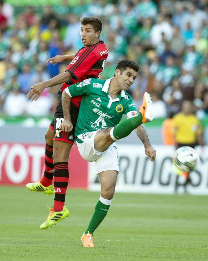 Rafael Marquez of Mexico's Leon fights for the ball with Lucas Mugni of Brazil's Flamengo (left) during a Copa Libertadores soccer match in Leon, Mexico on Wednesday.