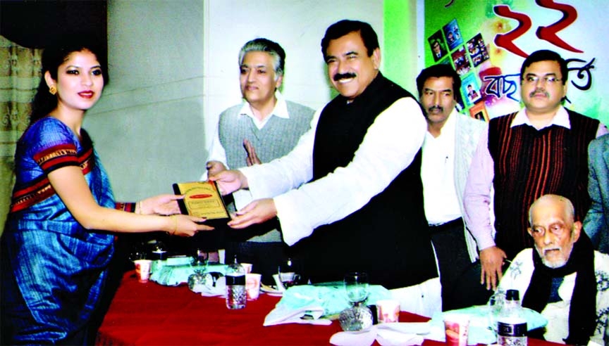 Shipping Minister Shajahan Khan handing over Business Award 2013 to Sarjana Mahtab, Director of Venture Group, on the occasion of celebrating 22nd anniversary of Bank, Bima and Shilpo Digest at a city hotel recently.