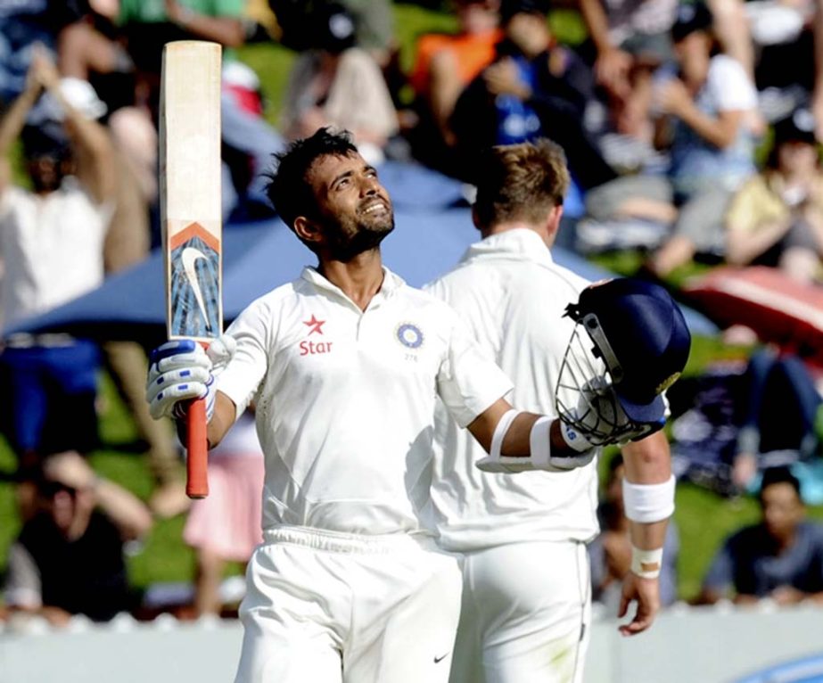 India's Ajinkya Rahane celebrates his first Test century against New Zealand on the second day of the second cricket Test in Wellington, New Zealand on Saturday.